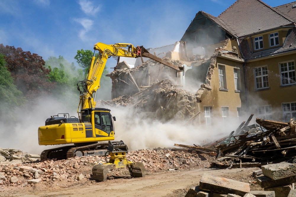 Construction Site Digger Yellow Demolishing House