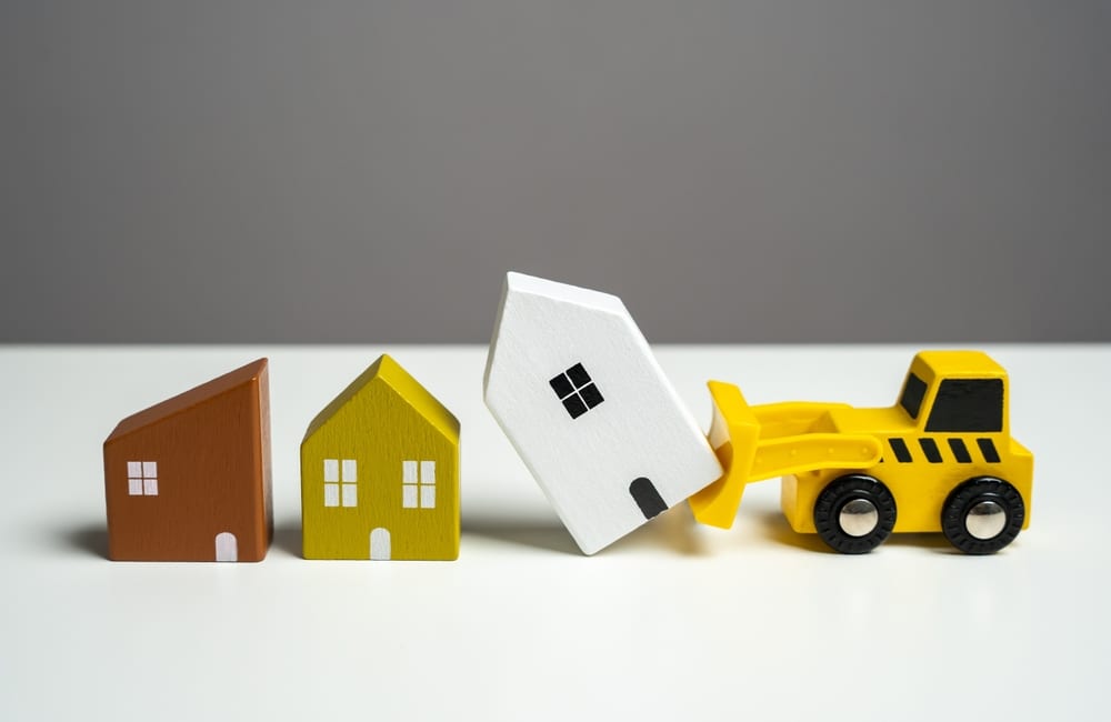 A Bulldozer Demolishes Houses